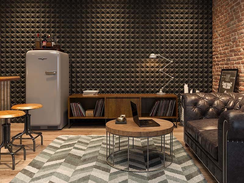 Finished basement lounge with exposed brick accent wall