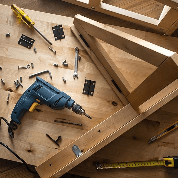 Carpenter assembling custom wood furniture